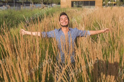 Preview: Young Handsome Man With Short Hair Posing In A Field