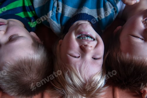 Preview: Three Happy Blond Boys Ate Lots Of Candy. Children'S Tongue Turned Blue From Marmalade. Striped