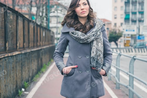 Preview: Beautiful Young Brunette With Long Hair Posing In An Urban Context