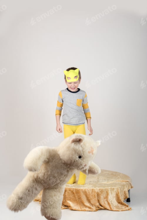 Preview: Happy Children In Elegant Yellow Clothes Play At Home. Boys In Feline Masks Posing For A Fashion