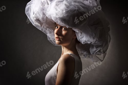 Preview: Portrait Of A Young Woman In A Big White Hat On Dark Background.