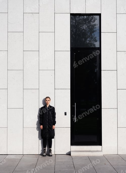 Preview: Street Style Fashion. Girl Model In Fashionable Clothes On A Background Of A Gray Wall.