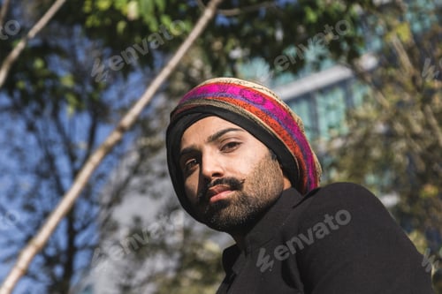 Preview: Handsome Indian Man Posing In An Urban Context. Street Fashion And Style.