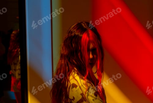 Preview: A Teenage Girl With Pink Hair In Neon Red And Blue Colors