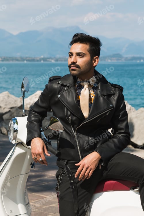 Preview: Handsome Indian Man Posing On A Scooter In A Vacation Context. Street Fashion And Style.