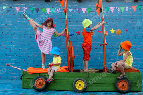 Preview: Three Happy Children Boys And Funny Girl Are Playing On Ship Made From Old Fishing Boat. Brothers