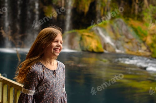 Preview: Little Girl Having Fun In Trip Near Waterfall