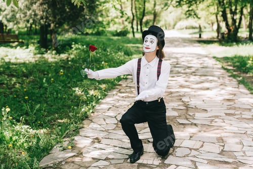 Preview: Funny Pantomime Gives A Red Rose On The Valentine Day.