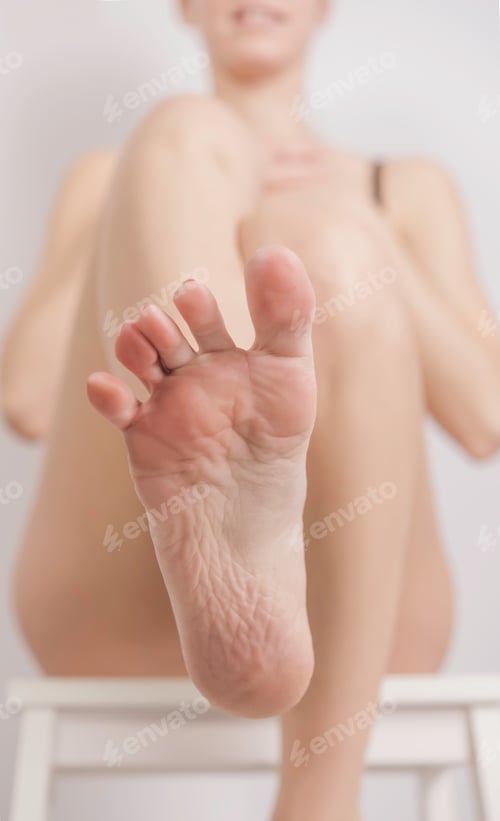 Preview: Female Bare Feet On White Background