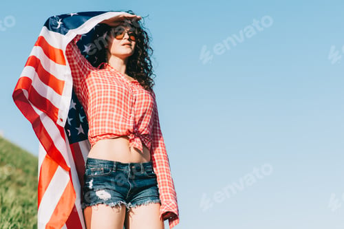 Preview: Girl With An American Flag. Independence Day Concept