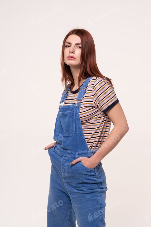Preview: Young Beautiful Girl Is Standing In Blue Overalls