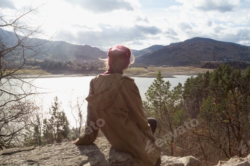 Preview: Girl Hipster Sits On The Background Of Romanian Carpathians Mountains