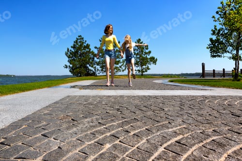 Preview: Summer And Vacation, Girls Sisters Running At The Park Near The River