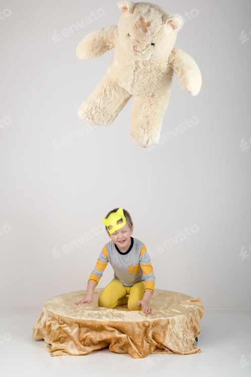 Preview: Happy Children In Elegant Yellow Clothes Play At Home. Boys In Feline Masks Posing For A Fashion