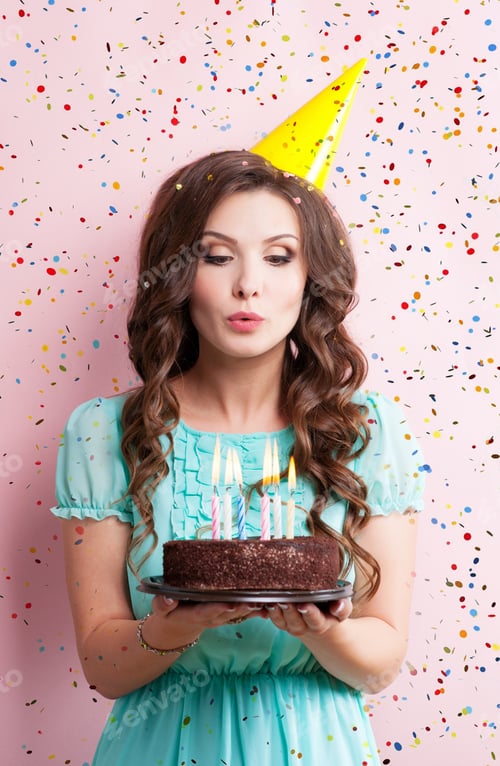 Preview: Bautiful Caucasian Girl Blowing Candles On Her Cake.