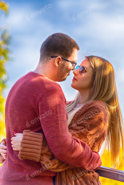 Preview: Young Couple In Love Embracing Outdoors And Looking Tenderly Into Each Others Eyes In A Close Up