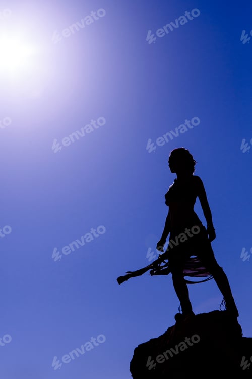 Preview: Woman Standing Agains The Sun In Timna Desert, Israel