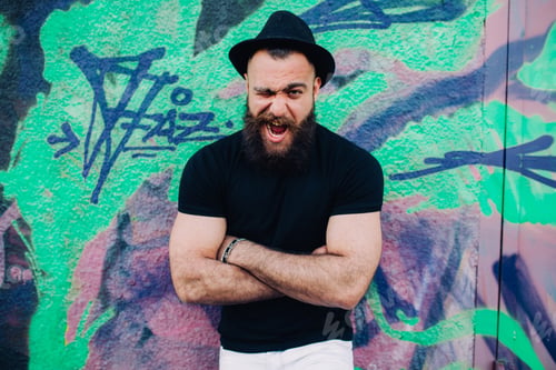 Preview: Bearded Man Is A Macho, Posing Near Wall With Graffiti