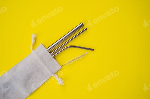 Preview: Reusable Straws in Fabric Pouch on Yellow Background