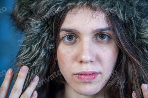 Preview: Young Girl With Long Hair In Faux Fur Hat In Pink Jacket And Stylish Coat Posing In Front Of Camera