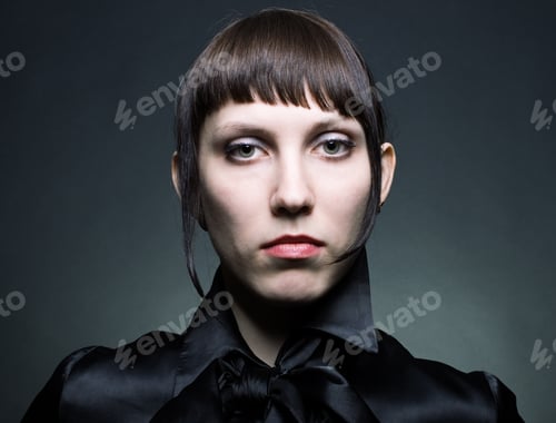 Preview: Portrait Of A Young Woman In A Stylish Retro Hairstyle.