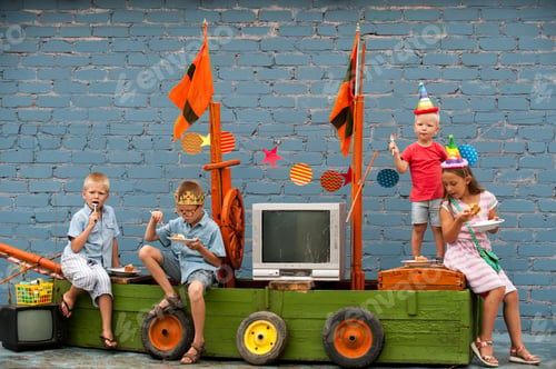 Preview: Happy Brothers-Boys In Colored Clothes And Girl Celebrate Birthday Of Youngest Boy On Pirate Ship