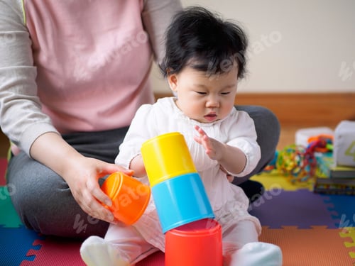 Preview: Asian Baby Girl Playing Stacking Cups