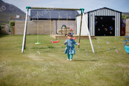Preview: Baby Girl Play Bubble At Summer Garden