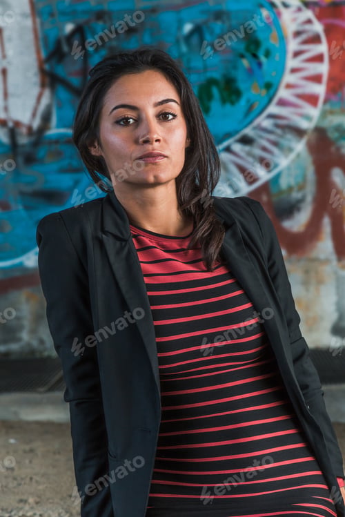 Preview: Beautiful Young Brunette With Long Hair Posing In An Urban Context