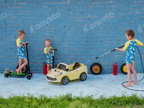 Preview: Funny Children In Boys' Bathing Suits Posing In Front Of Camera With High-Pressure Car Wash And Toy