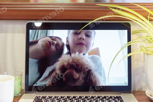 Preview: Laptop Webcam Blurry Screen Of Boy And Girl With A Dog Having Video Chat During Quarantine Due To