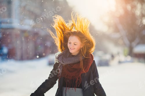 Preview: Positive Redhead Girl On The Sun In Frozen Winter Day