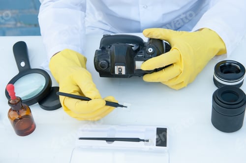 Preview: Elderly Solid Person In White Dressing Gown, Cap, Medical Mask, Glasses Cleans Matrix Of Digital