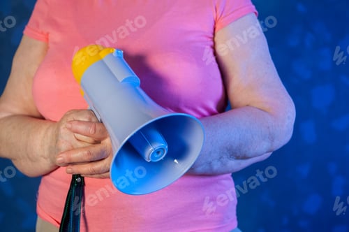 Preview: Beautiful Senior Woman Is Excited, Euphoric, Screaming With Megaphone, Sign Of Revolution And