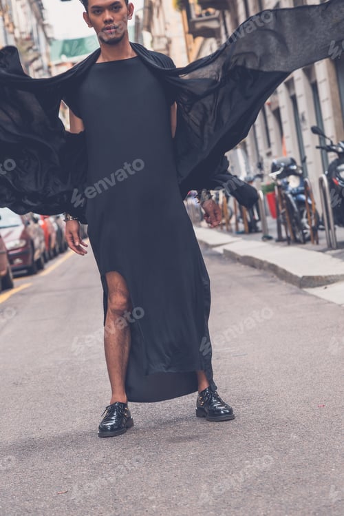 Preview: Young Handsome Asian Model Dressed In Black Tunic Posing In The City Streets