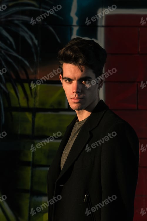 Preview: Beautiful Young Man With Short Hair Posing In An Urban Context