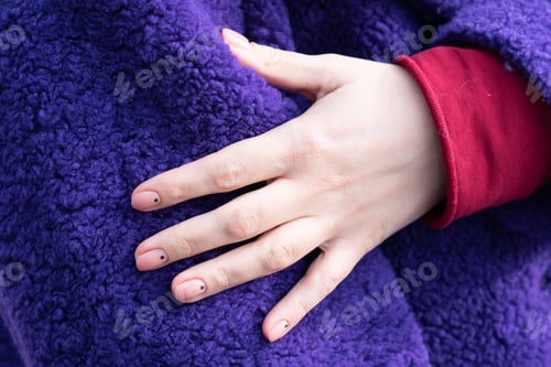 Preview: Girl'S Hand On A Purple Coat