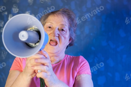Preview: Beautiful Senior Woman Is Excited, Euphoric, Screaming With Megaphone, Sign Of Revolution And