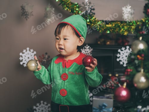 Preview: Baby Girl Decorating Christmas Tree
