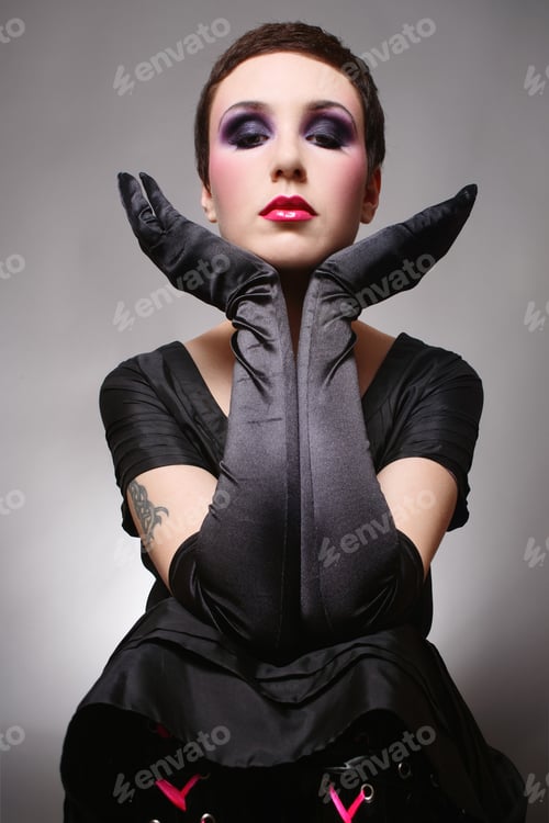 Preview: Beautiful Girl With Stylish Haircut And Makeup In Black Gloves
