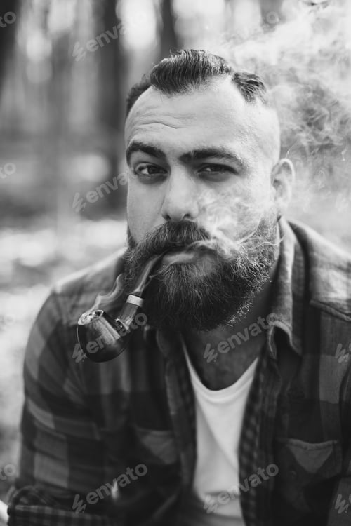Preview: Bearded Man Smoke A Pipe In The Forest