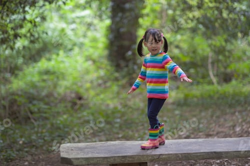 Preview: Young Girl Playing In The Summer Forest Park