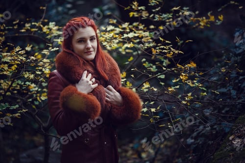 Preview: Beautiful Red-Haired Young Woman Is Walking In The Autumn Park. Melancholy Mood