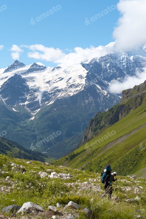 Preview: Hiker To Go Uphill And Mountains With Blue Sky In The Background