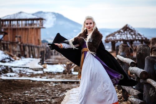 Preview: Beautiful Young Woman Holding A Viking With Blond Hair. Image Of Historical Figure
