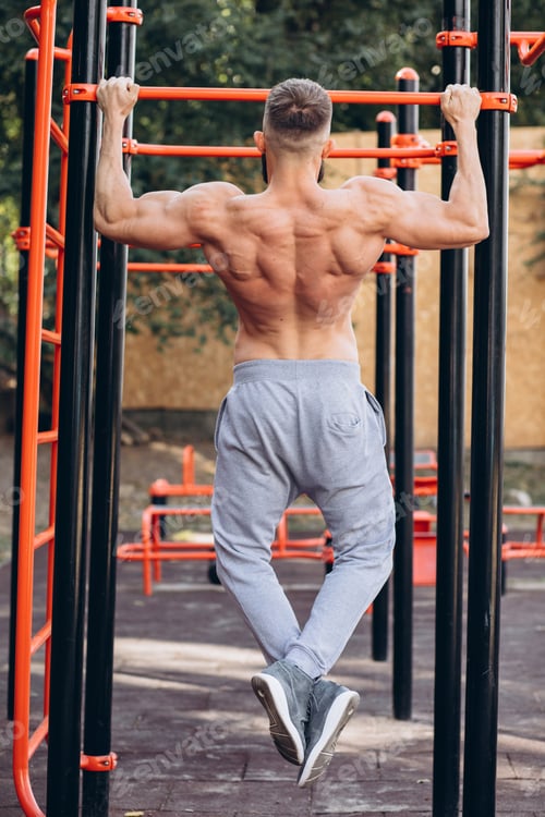 Preview: Strong Muscular Bearded Man Doing Push-Ups On Uneven Bars In Outdoor Street Gym. Workout Lifestyle