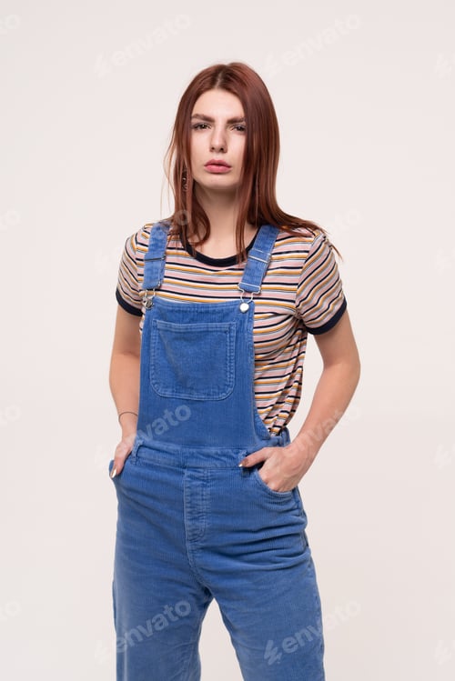 Preview: Young Beautiful Girl Is Standing In Blue Overalls