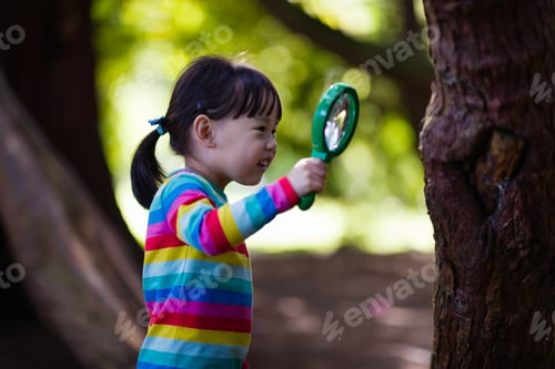 Preview: Young Girl Holding A Magnifier And Looking Up In The Summer Forest Morning