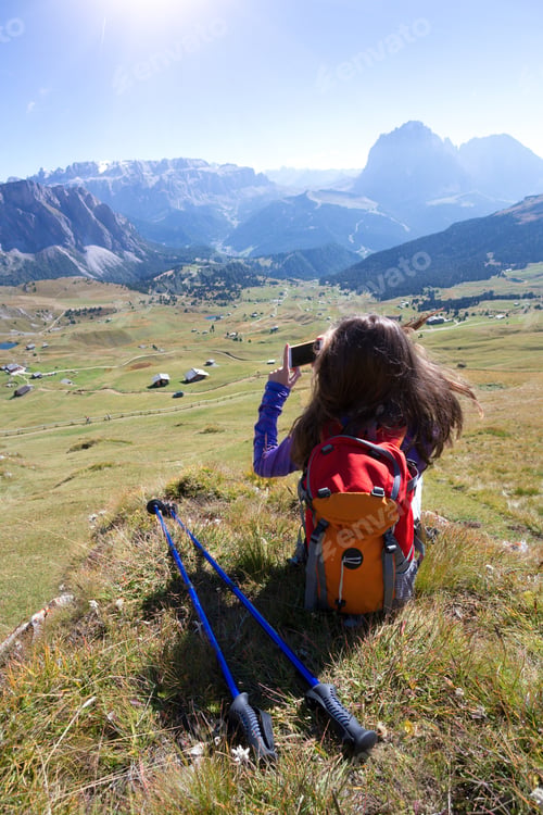 Preview: Girl Hiker Taking A Photo On A Smartphone At The Mountains Dolomites And Views Of The Valley