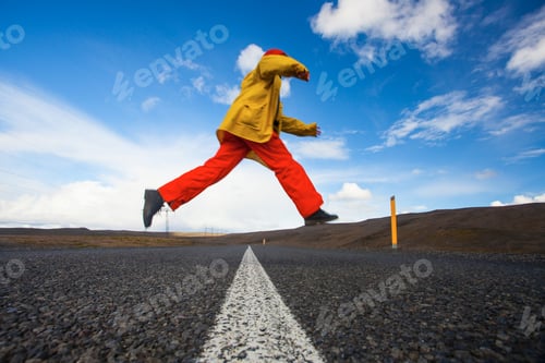 Preview: Happy Tourist Woman In Bright Clothes And Yellow Coat , Enjoying Traveling Iceland
